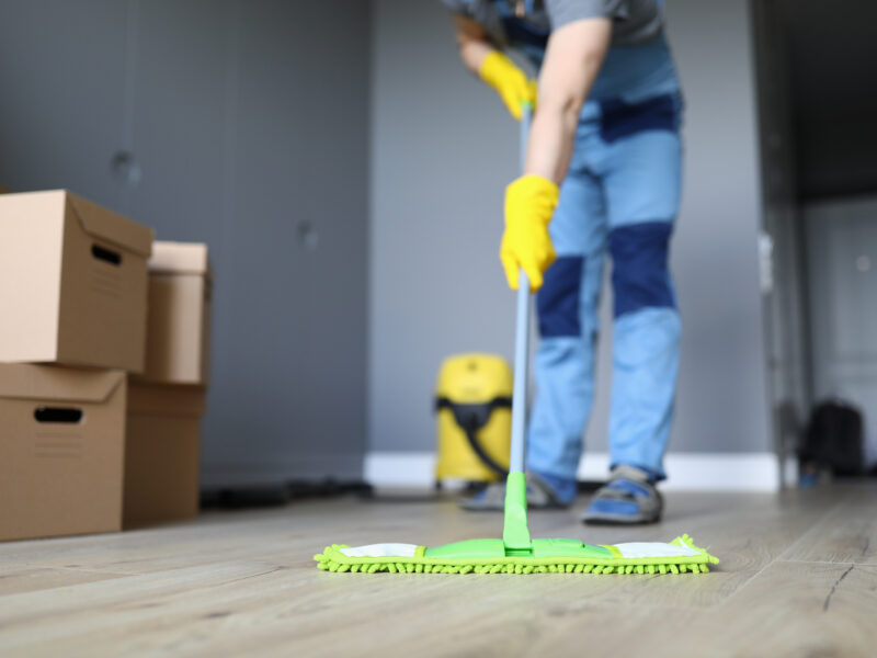 Close-up,Of,Professional,Cleaner,Washing,Floor,With,Green,Mop.,Man