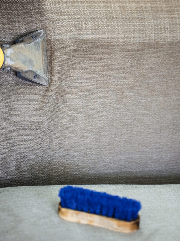 Cleaning,A,Couch,With,A,Vacuum