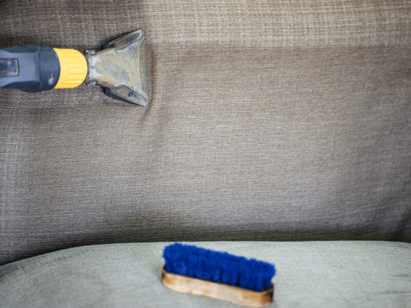 Cleaning,A,Couch,With,A,Vacuum